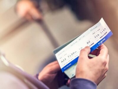 A person holding a ticket